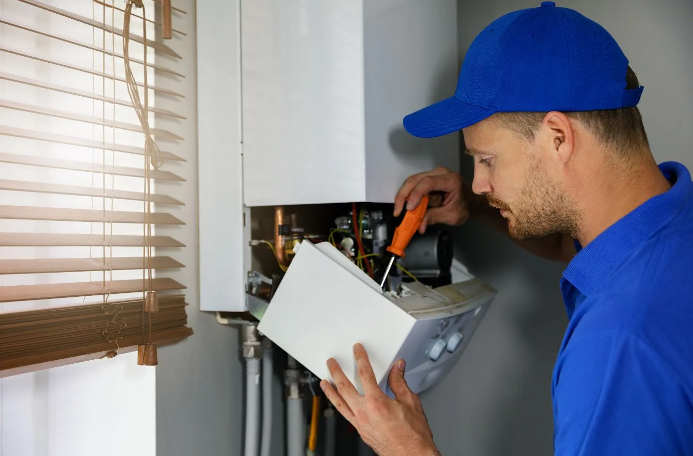 Gas Boiler Installation in Lochgelly by MPH Boilers An MPH Boilers technician installing a new gas boiler in a Lochgelly home, ensuring efficient and safe heating.