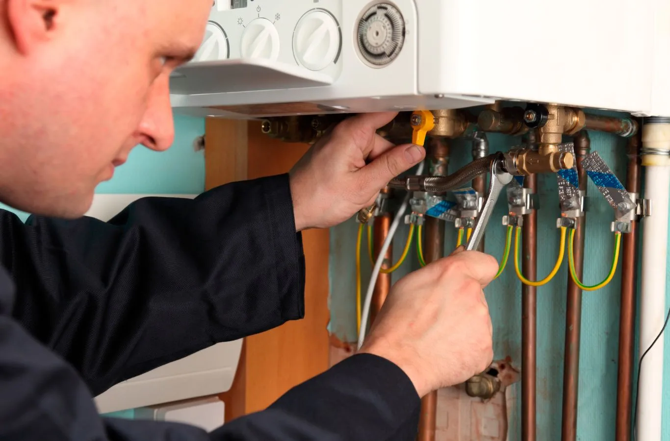 Why Choose Oil Boiler Installation in Lochgelly by MPH Boilers An expert from MPH Boilers performing oil boiler installation in Lochgelly, offering reliable service and high efficiency. Oil Boiler Installation Near Me.