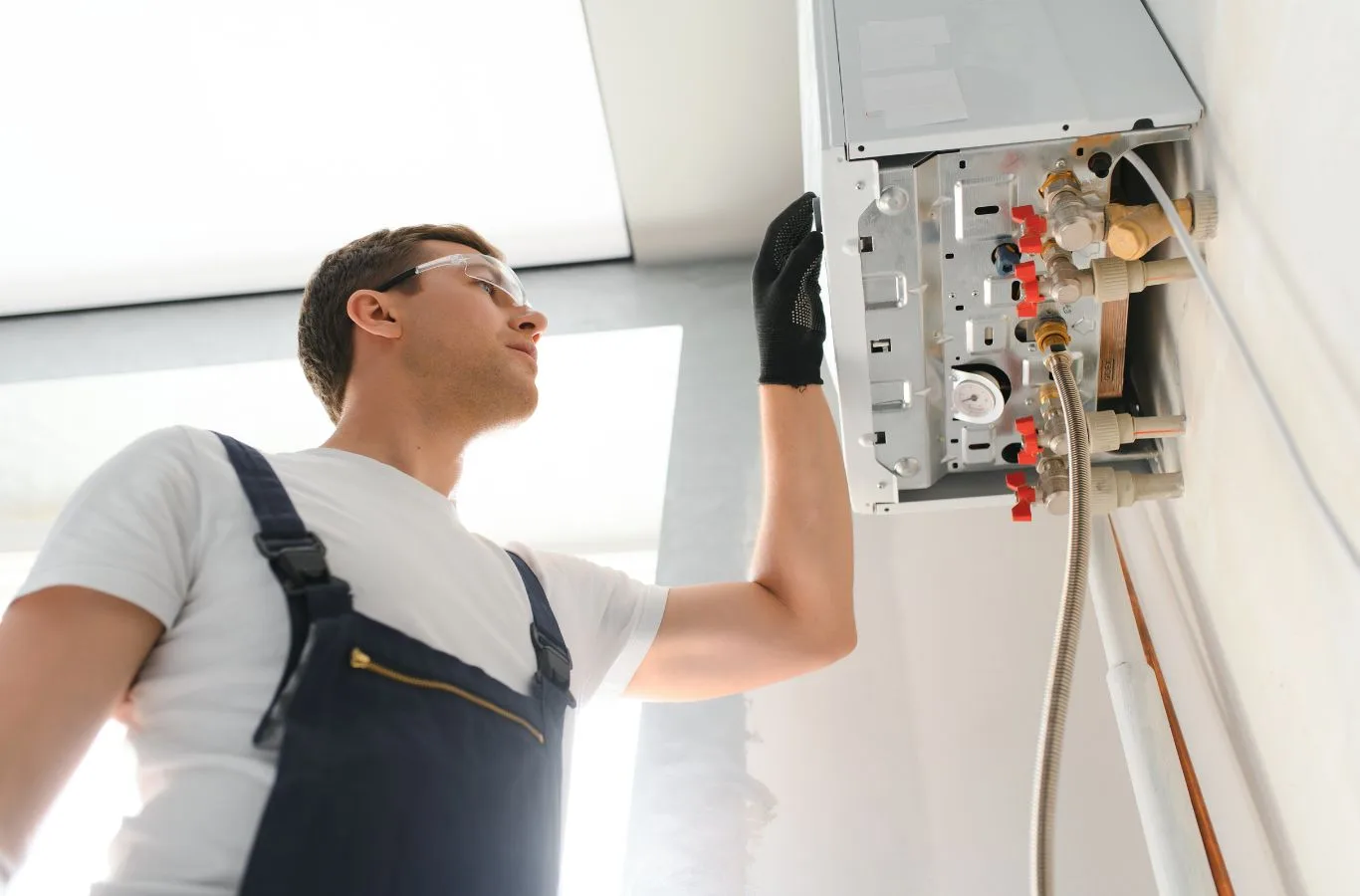 An MPH Boilers engineer performing an oil boiler installation in Cardenden, ensuring reliable heating for local homes.