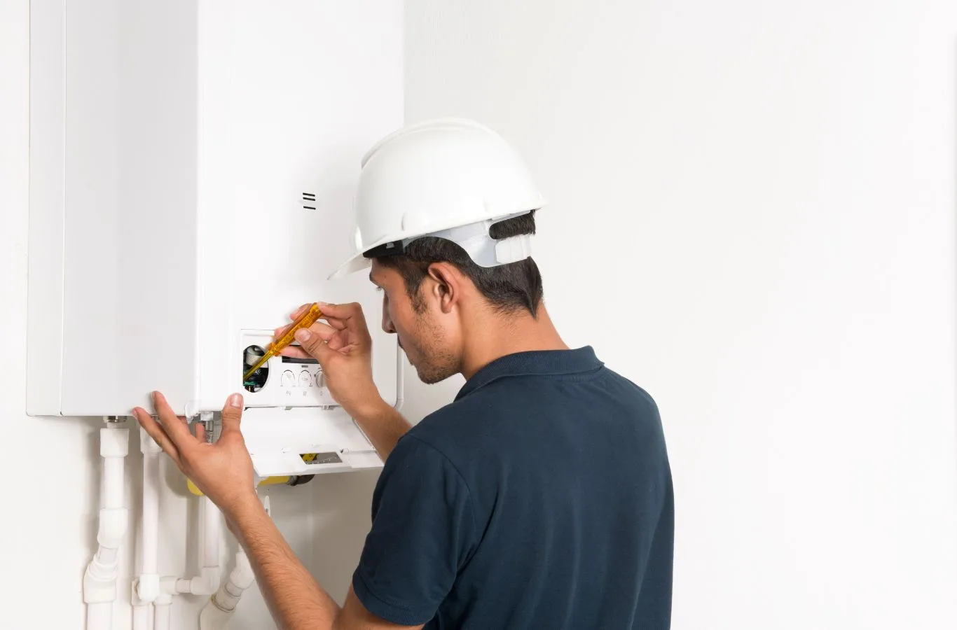 Benefits of Boiler Installation in Edinburgh by MPH Boilers A MPH Boilers technician demonstrating efficient boiler installation in Edinburgh, highlighting the benefits of local expertise and professionalism.