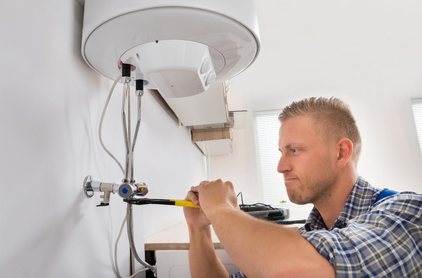 A technician from MPH Boilers installing a boiler in Glasgow, ensuring professional and reliable service.